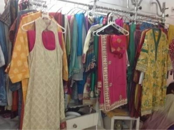 K C TAILORS AND DRAPERS